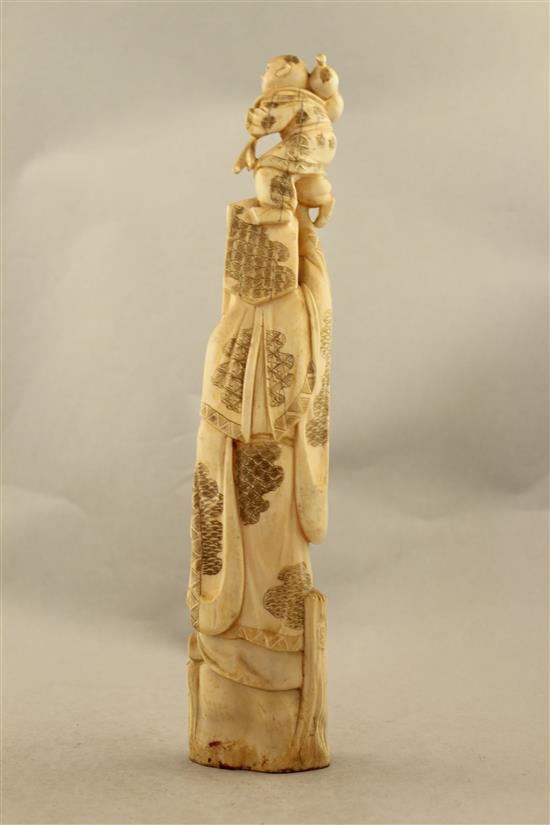 A Japanese walrus ivory tusk carving of Jurojin, early 20th century, 33.5cm